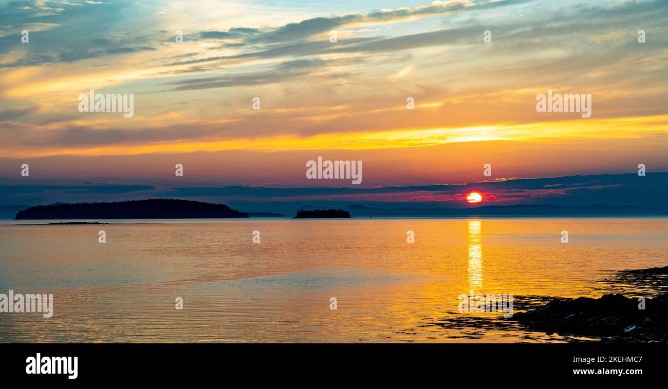 The Sunset across Penobscot Bay, viewed from NW Harbor, Deer Isle, Maine Stock Photo