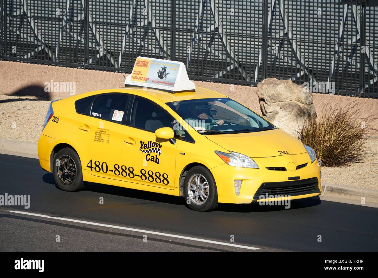 Phoenix, Arizona, USA - November 4, 2022: A Yellow Cab taxi arriving at Phoenix airport with passenger. Stock Photo