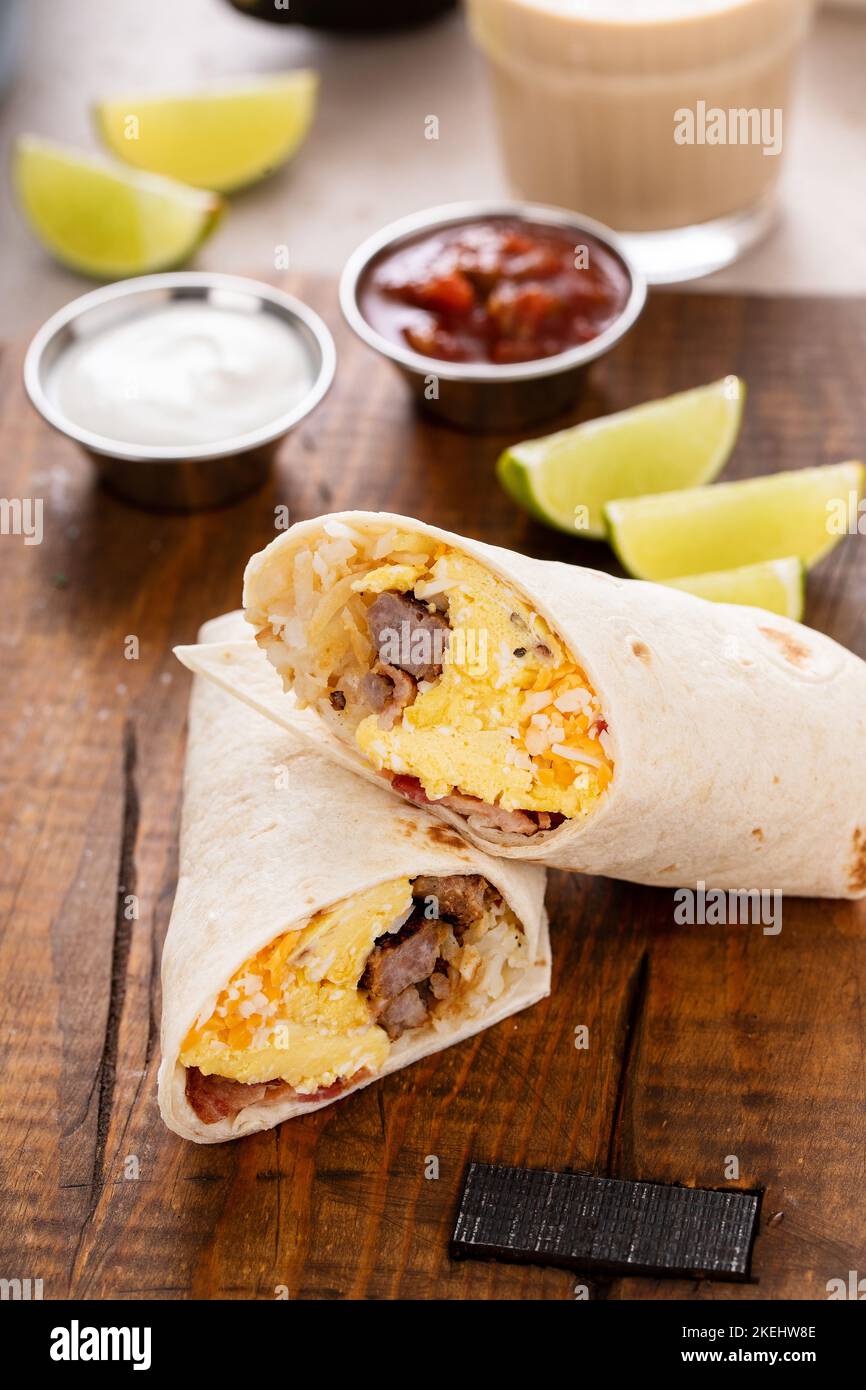 Breakfast burrito with sausage, eggs, hashbrown and cheese Stock Photo