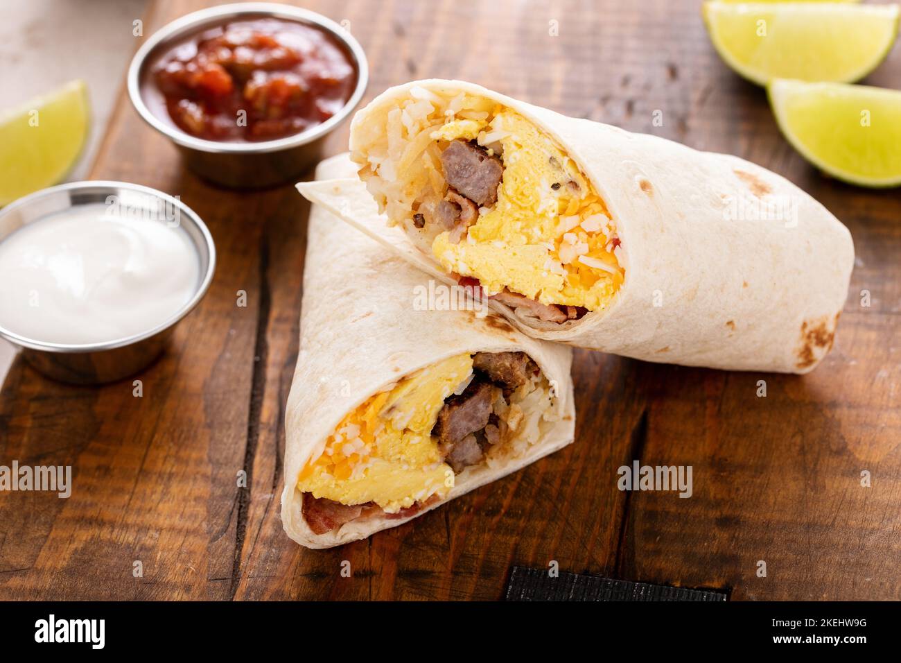 Breakfast burrito with sausage, eggs, hashbrown and cheese Stock Photo