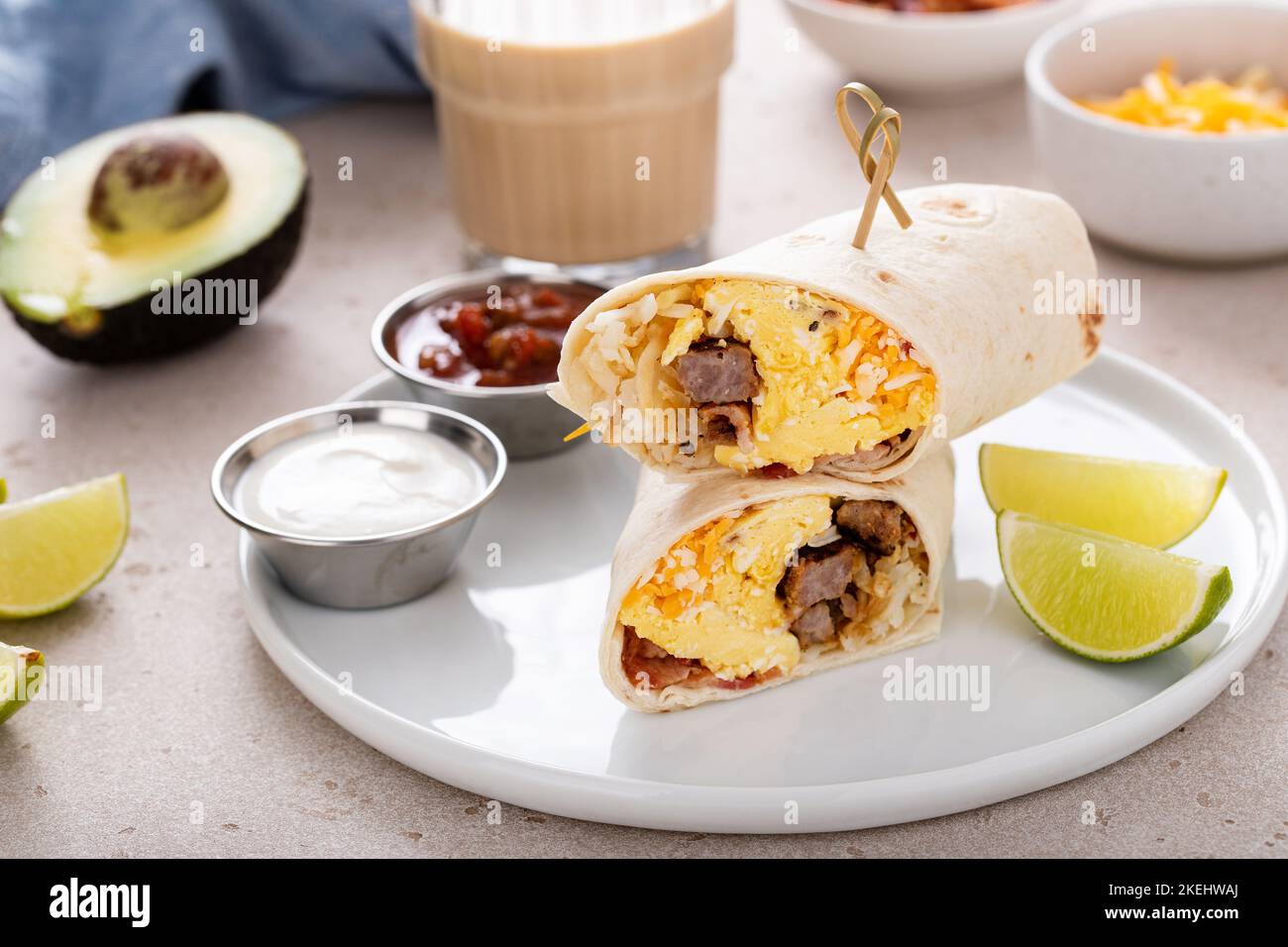 Breakfast burrito with sausage, eggs, hashbrown and cheese Stock Photo