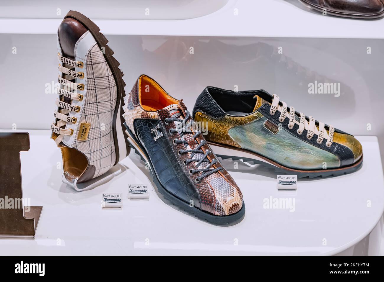 25 July 2022, Munster, Germany: Fashionable and vintage Harris shoes in the footwear shop window Stock Photo
