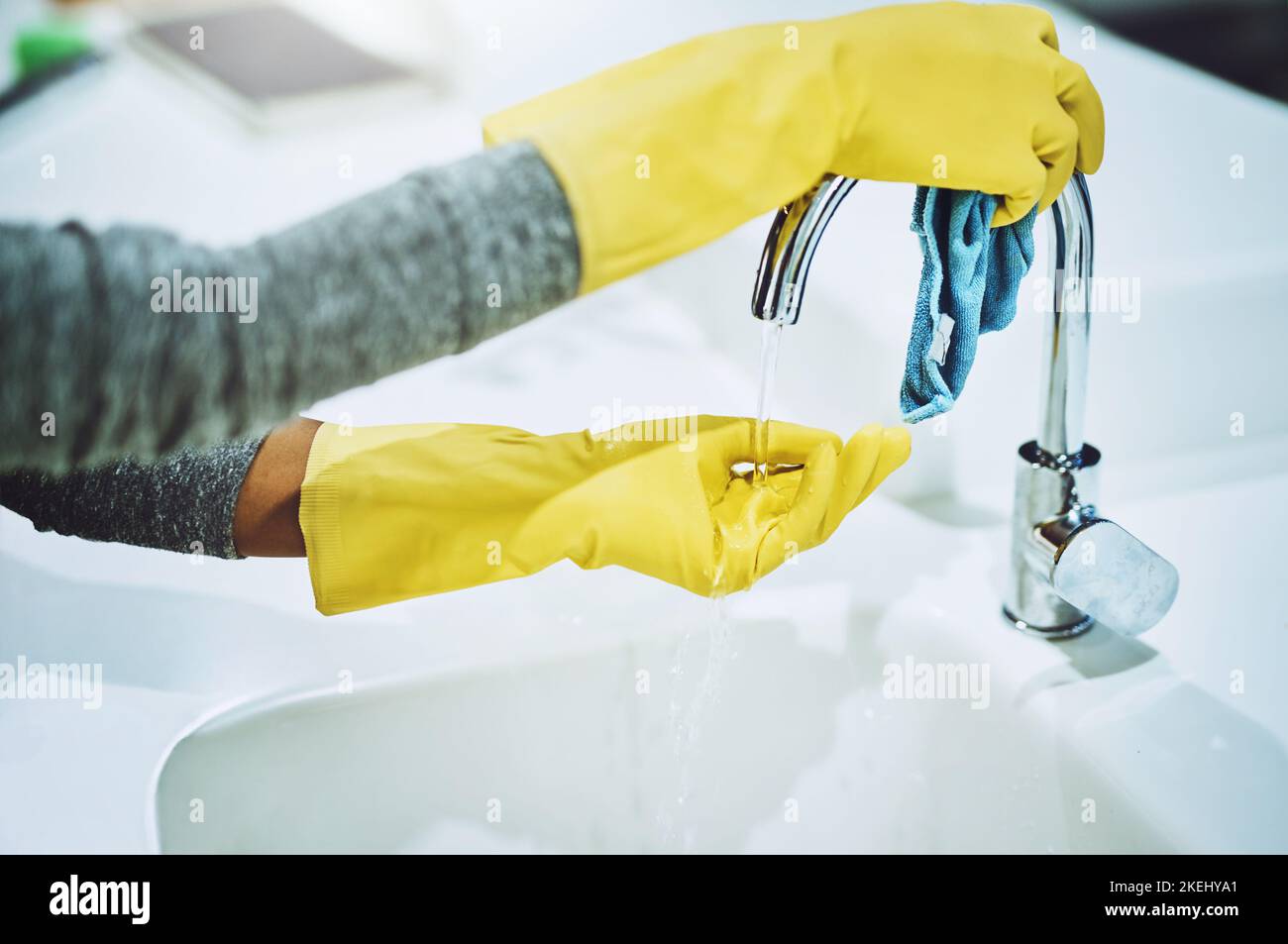 Got to kill those germs. a unrecognizable person with yellow gloves