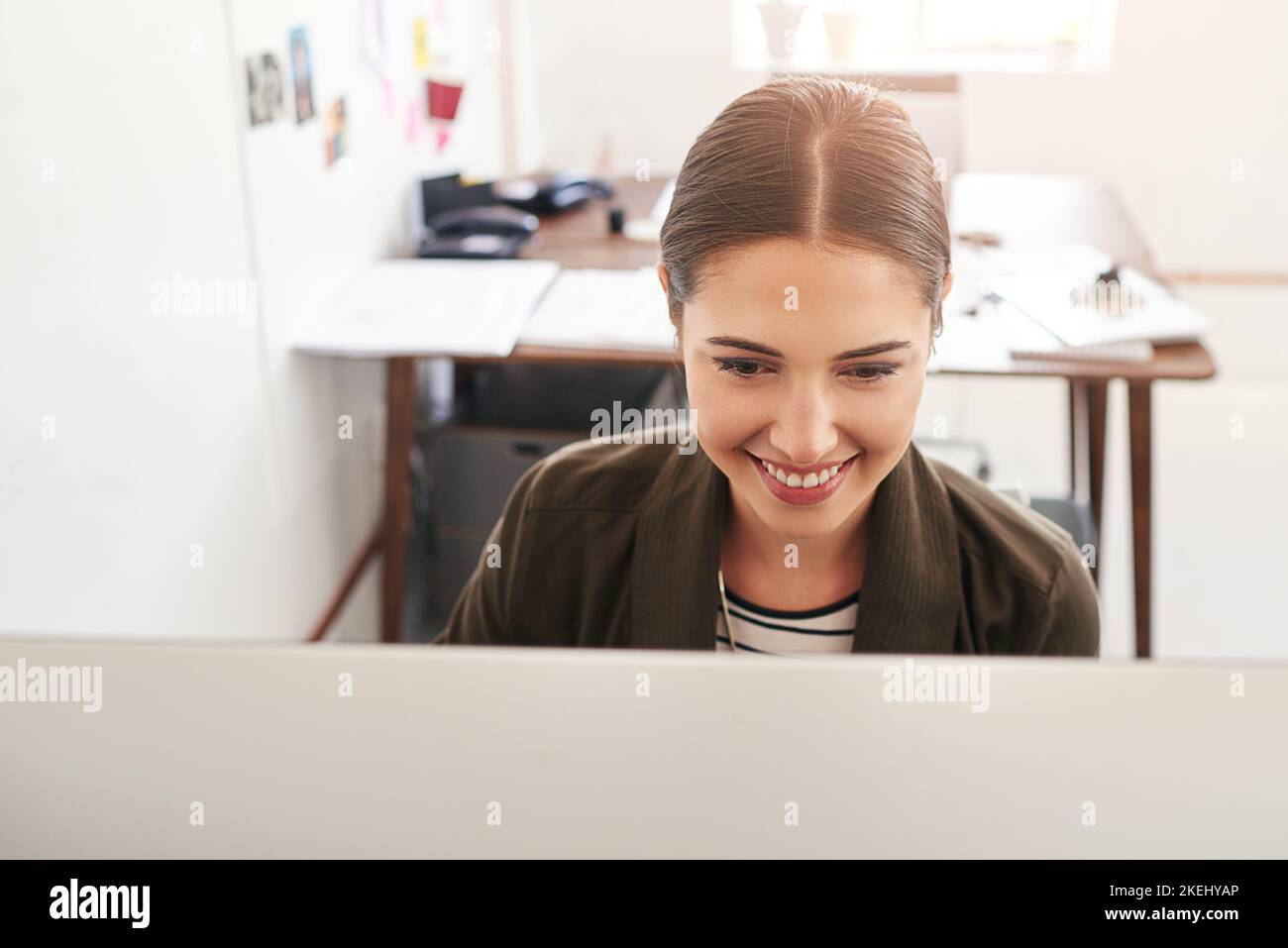 Working hard to achieve success. a young businesswoman working in her ...
