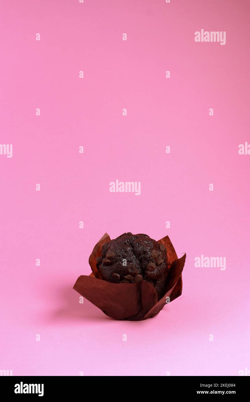 chocolate chip muffin isolated on pink background  Stock Photo