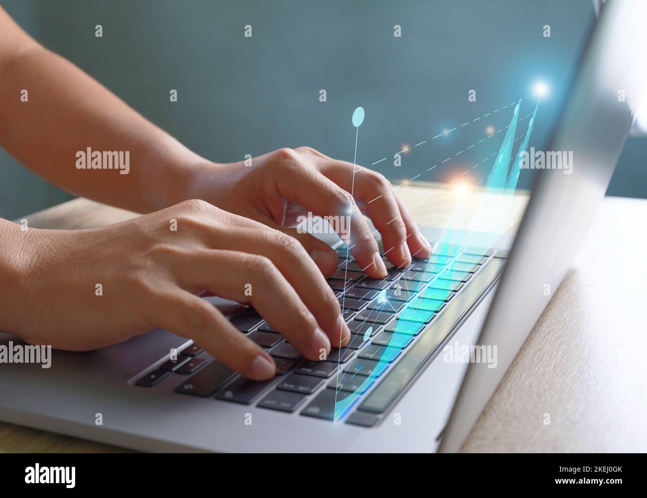 Businessmen use a laptop to view company financial reports and graphics showing financial growth data and figures financial management concepts, plann Stock Photo