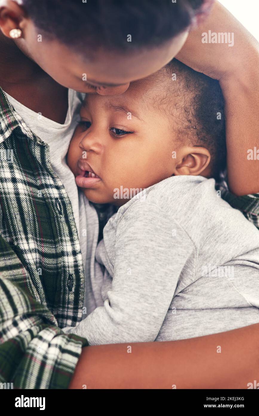 Hush my little baby. a mother cradling her little baby boy. Stock Photo