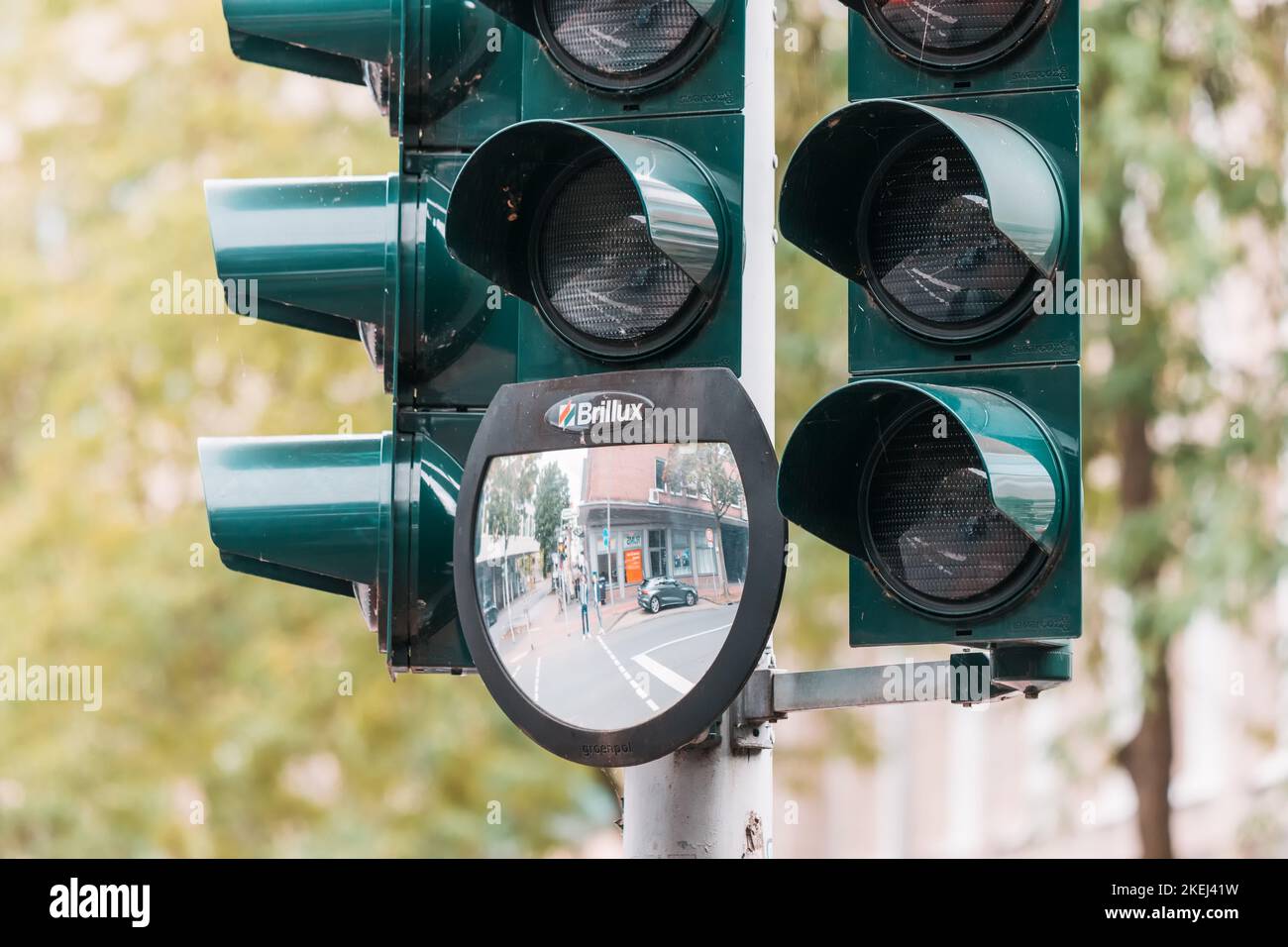 26 July 2022, Munster, Germany: traffic light with a mirror and with an additional section for cyclists Stock Photo