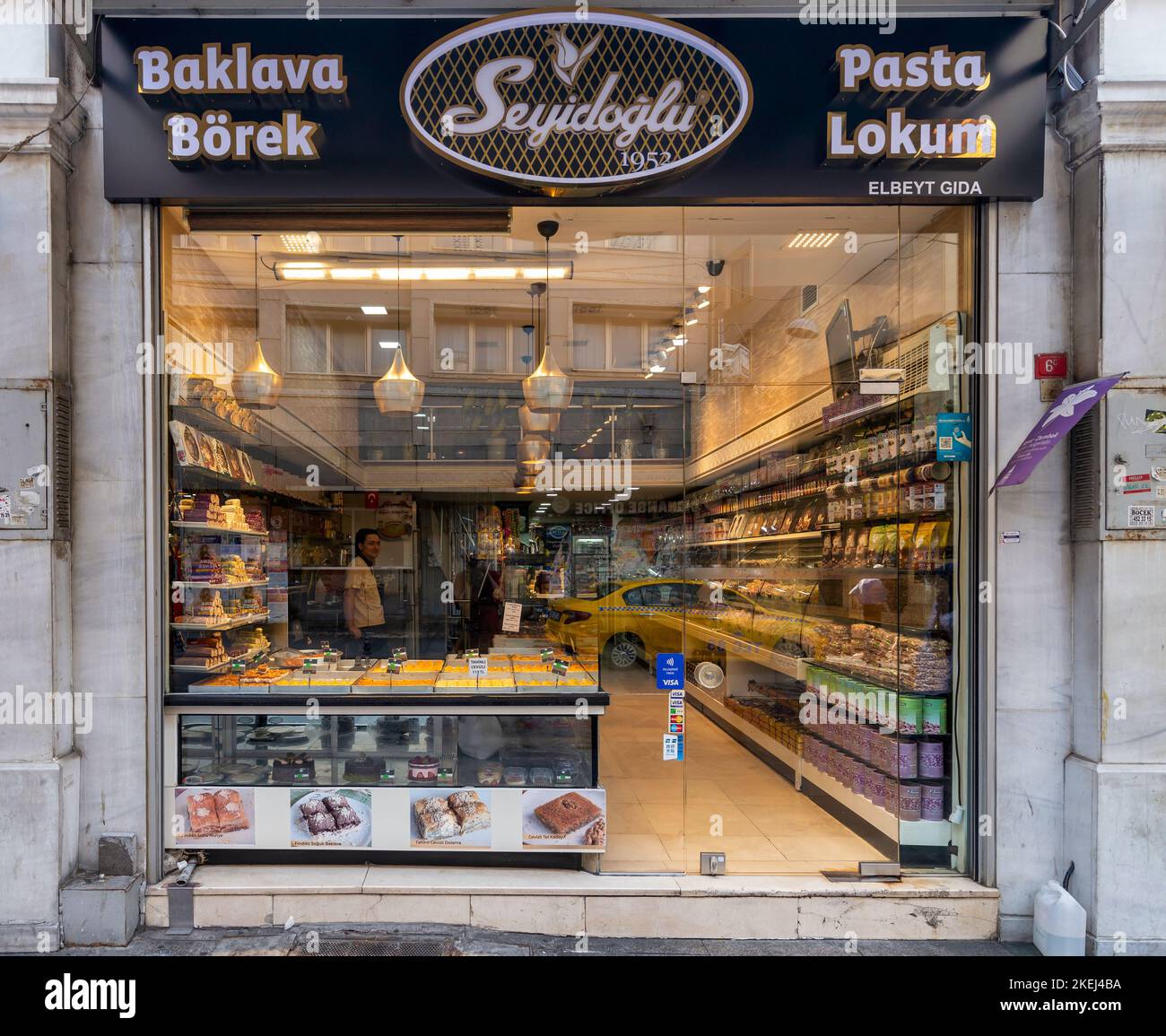 Group portrait of several young guys and one elderly man near stall with  turkish bagel at Taksim in Beyoglu, Istanbul Stock Photo - Alamy