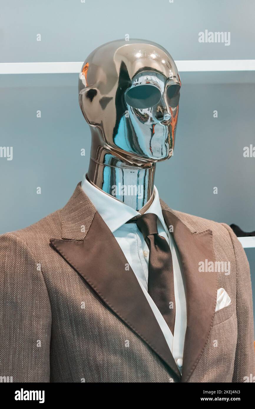 Men suit with tie on a mannequin in an expensive and stylish store Stock Photo