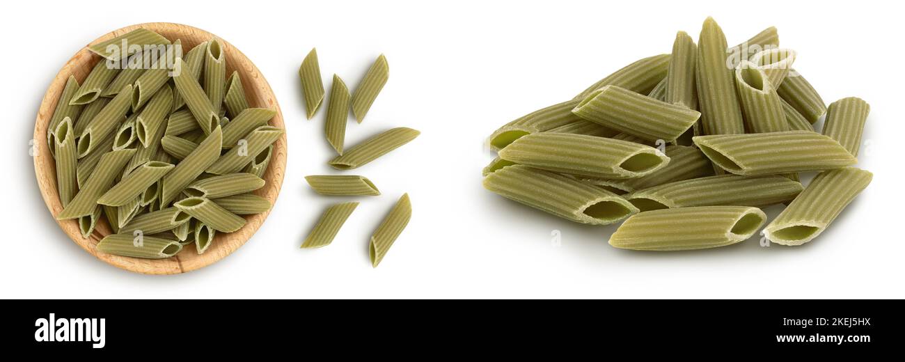 Green pea penne pasta in wooden bowl isolated on white background with. Organic food speciality. Gluten free. Top view. Flat lay Stock Photo