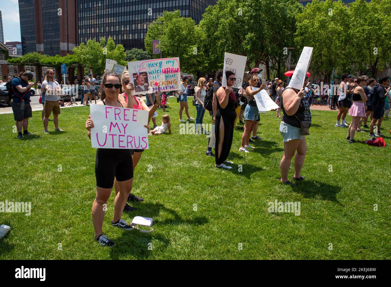 Woman protester at a pro-choice rally holds a feminist FREE MY UTERUS sign Stock Photo