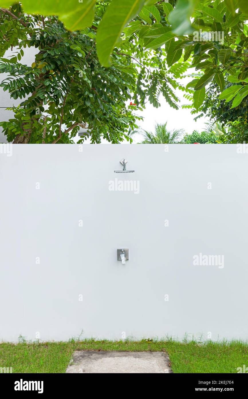 Exterior design of outdoor shower in green garden Stock Photo