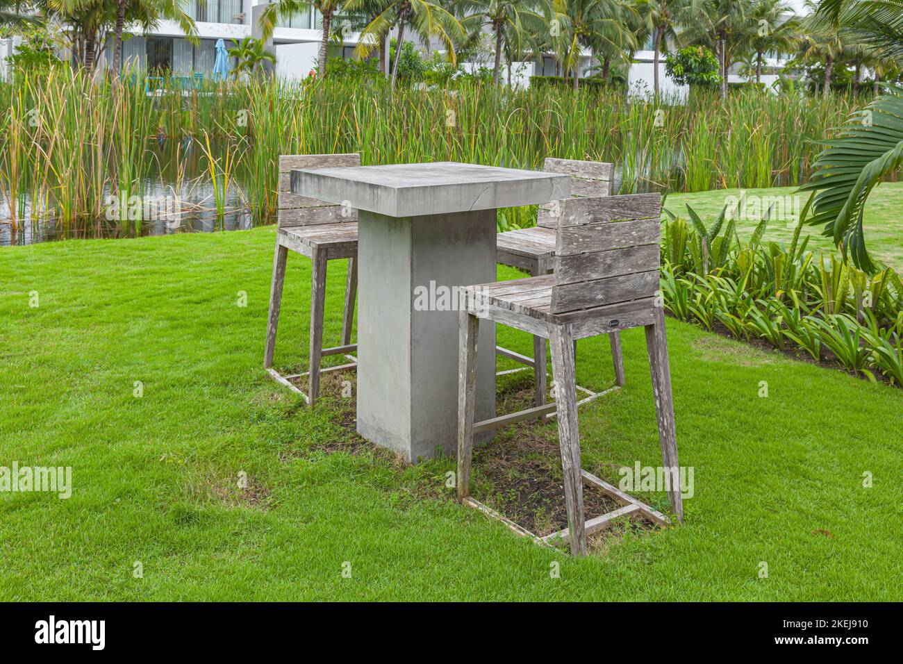 Concrete, Cement Table and wooden chair in gray neutral tones on