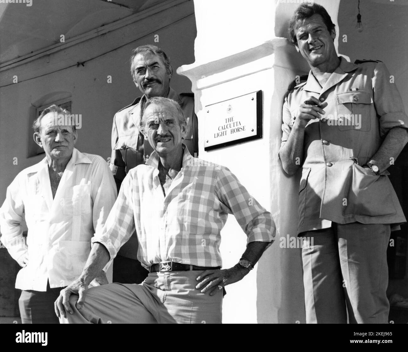 TREVOR HOWARD GREGORY PECK DAVID NIVEN and ROGER MOORE on location in India candid group portrait during filming of THE SEA WOLVES 1980 director ANDREW V. McLAGLEN book Boarding Party by James Leasor screenplay Reginald Rose producer Euan Lloyd Switzerland - UK - USA co-production Lorimar Productions / Richmond Light Horse Productions / Varius Entertainment Trading A.G. / Rank Film Distributors Stock Photo