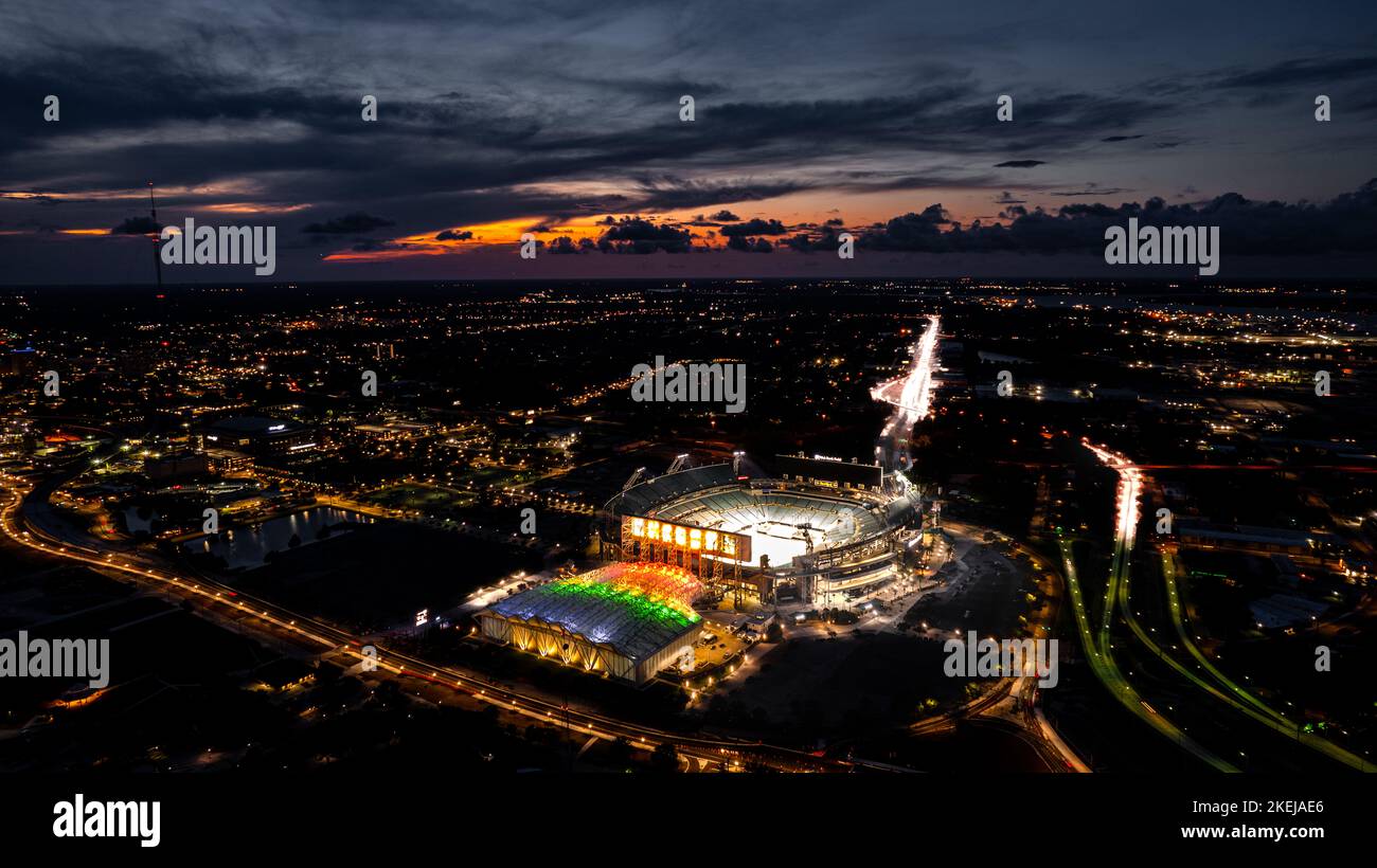 The glowing Jacksonville cityscape with the TIAA Bank Field at night in Florida Stock Photo