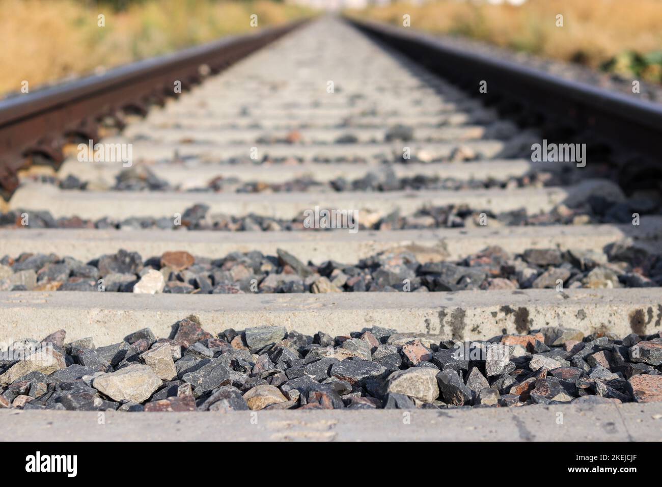 Train track, stones between the tracks.Selective focus Stock Photo Alamy