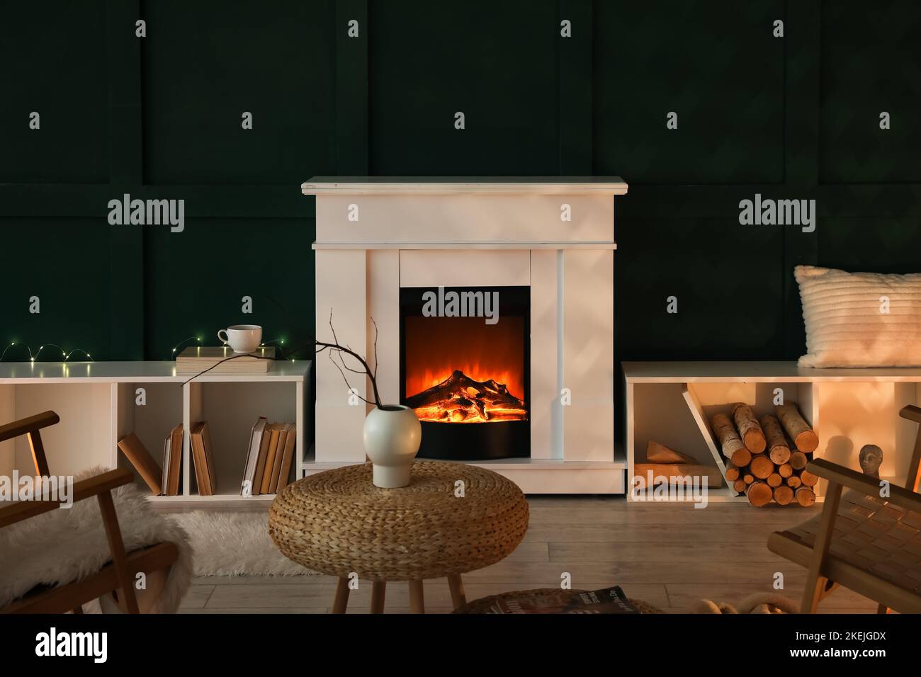 Interior of dark living room with fireplace and shelving units Stock ...