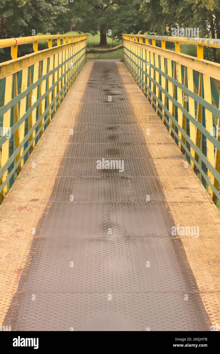 A vertical of a bridge over the Bystrzyca river on a rainy day in Lublin, Poland. Stock Photo