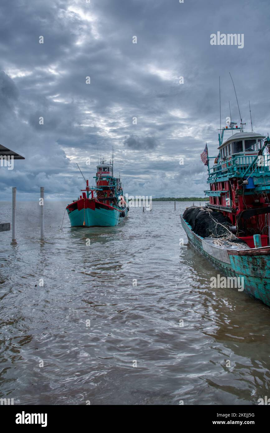 scene of fishing boats harbor at the dock Stock Photo - Alamy