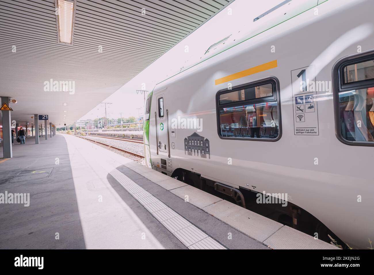 27 July 2022, Munster, Germany: A railway platform with a modern DB ...