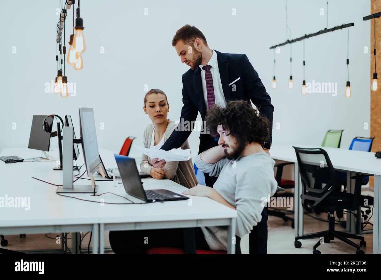 Group of multi-ethnic colleagues working on desktop computers, laptop ...