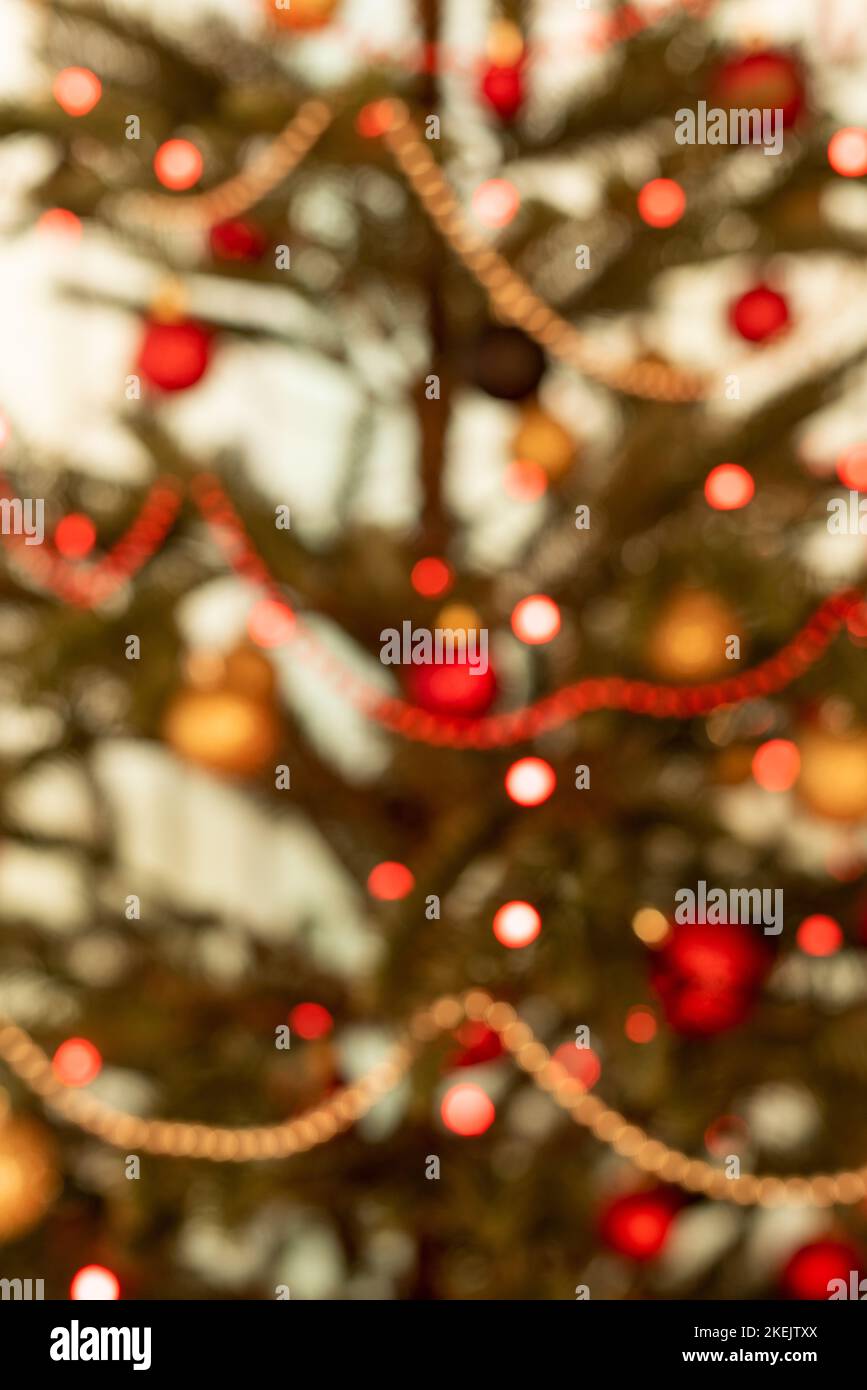 Part of a Christmas tree decorated with lights - soft focus Stock Photo