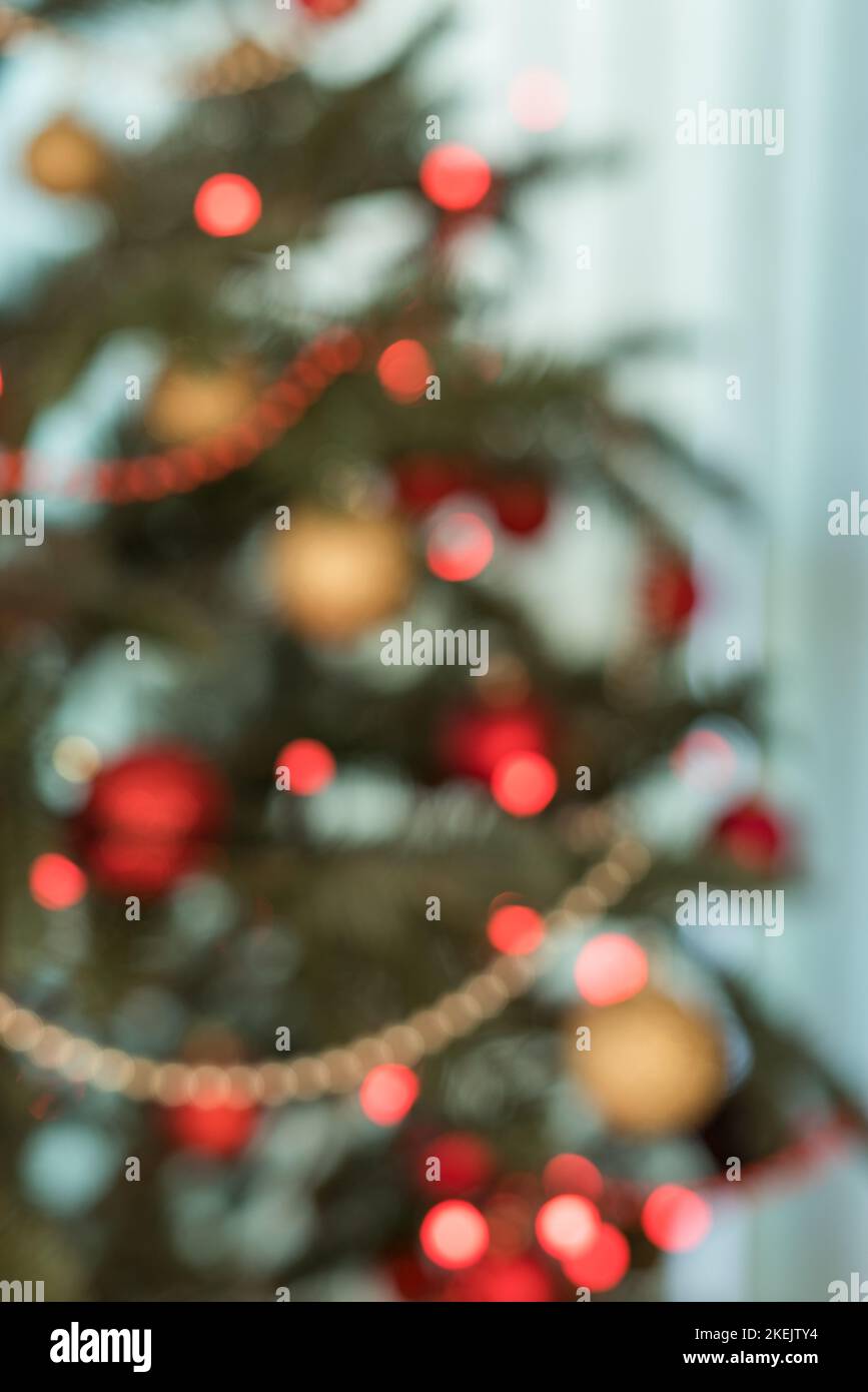 Part of a Christmas tree decorated with lights - soft focus Stock Photo