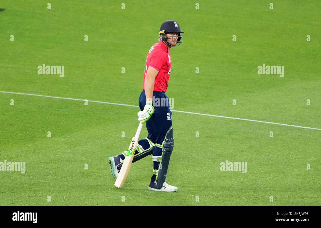 England's Jos Buttler leaves the field after being dismissed during the