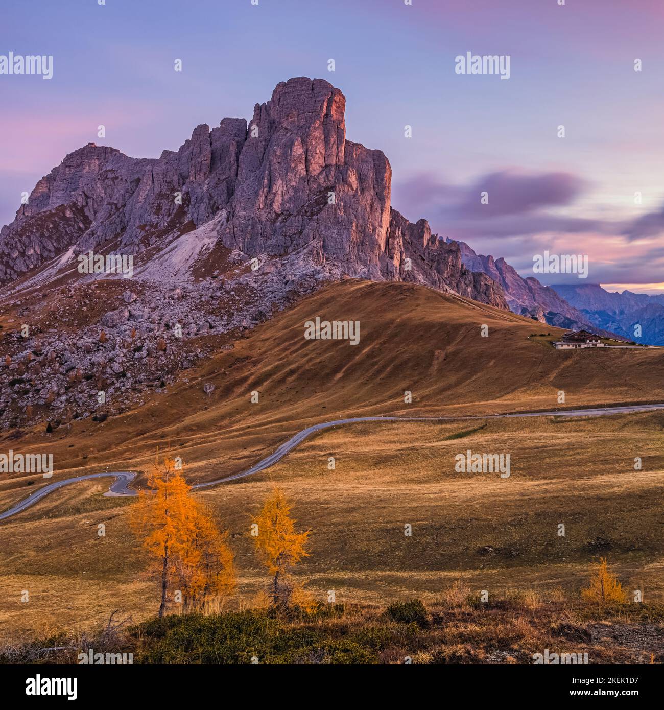 It is autumn in the Dolomites and a beautiful sunrise on the Giau Pass