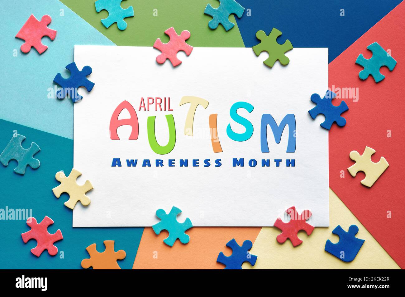 Text April, World Autism Awareness Month, frame with puzzle pieces. Banner,  wallpaper, background for flyer, poster for Health Care Awareness campaign  Stock Photo - Alamy