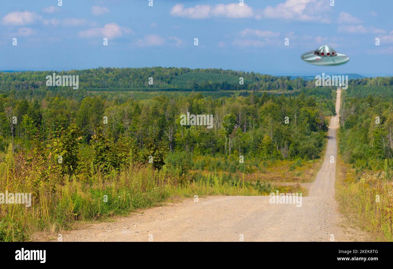 UFO hovering over a dirt road in remote Maine Stock Photo