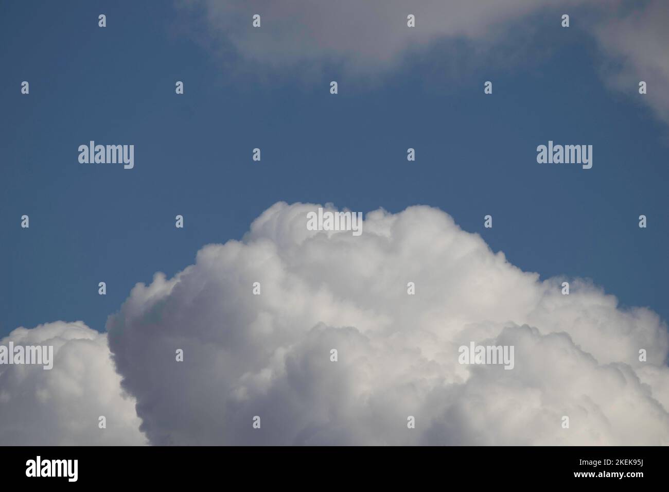 blue sky and white fluffy clouds on a sunny day Stock Photo - Alamy