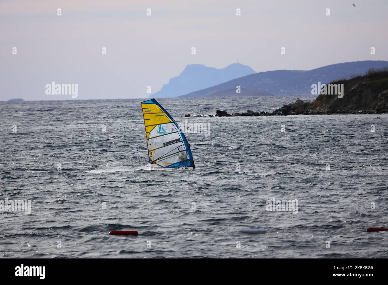 Bodrum, Mugla, Turkey. 23 September 2022 : An athlete doing windsurfing in the Aegean Sea. Stock Photo