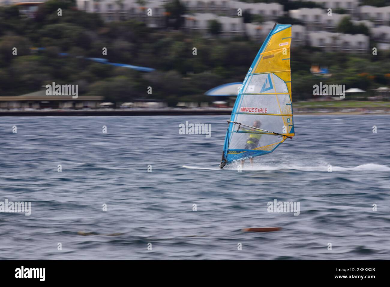 Bodrum, Mugla, Turkey. 23 September 2022 : An athlete doing windsurfing in the Aegean Sea. Stock Photo