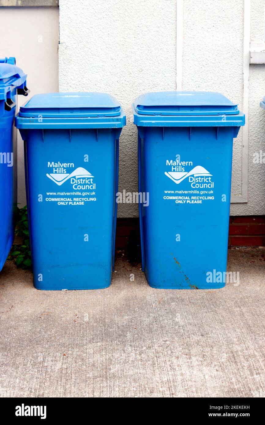 two blue plastic commercial waste recycling bins Malvern Hills district