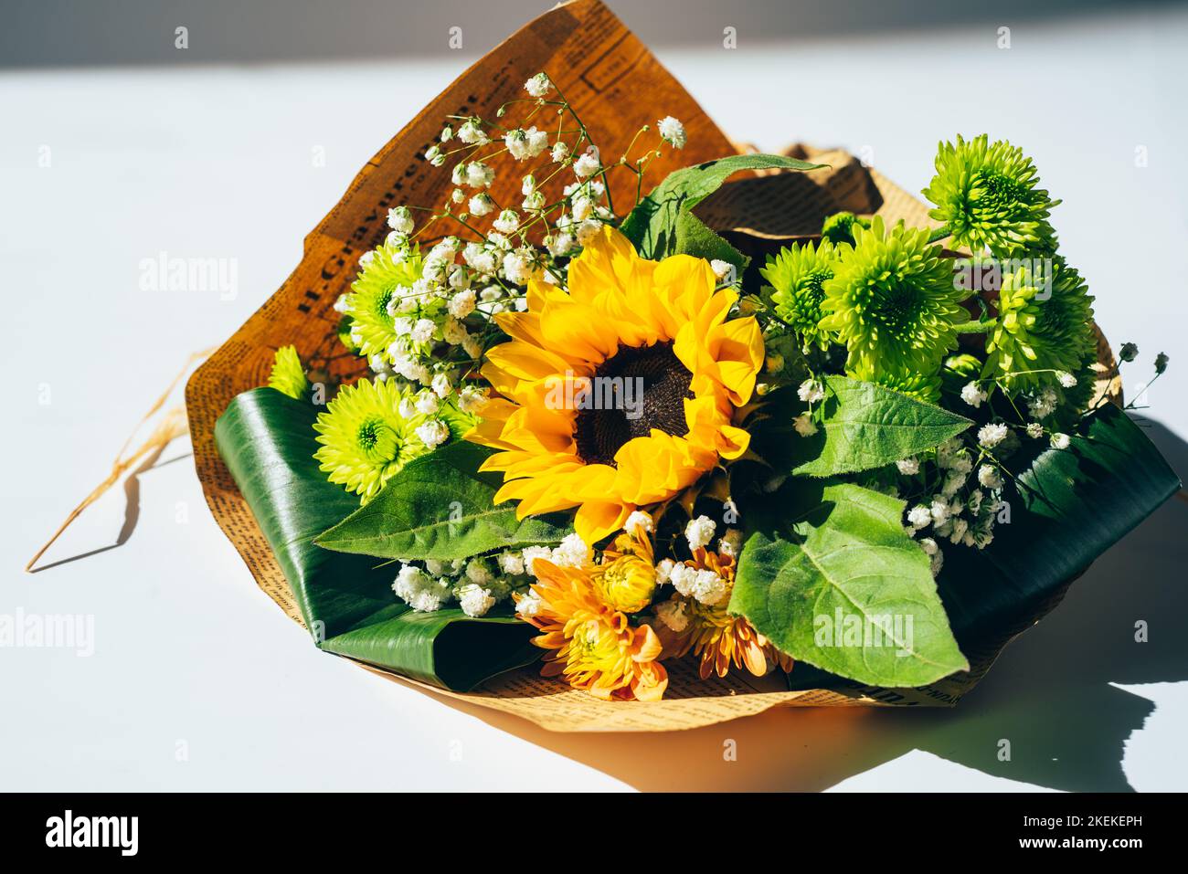 Bouquet of flowers wrapped in paper Stock Photo Alamy