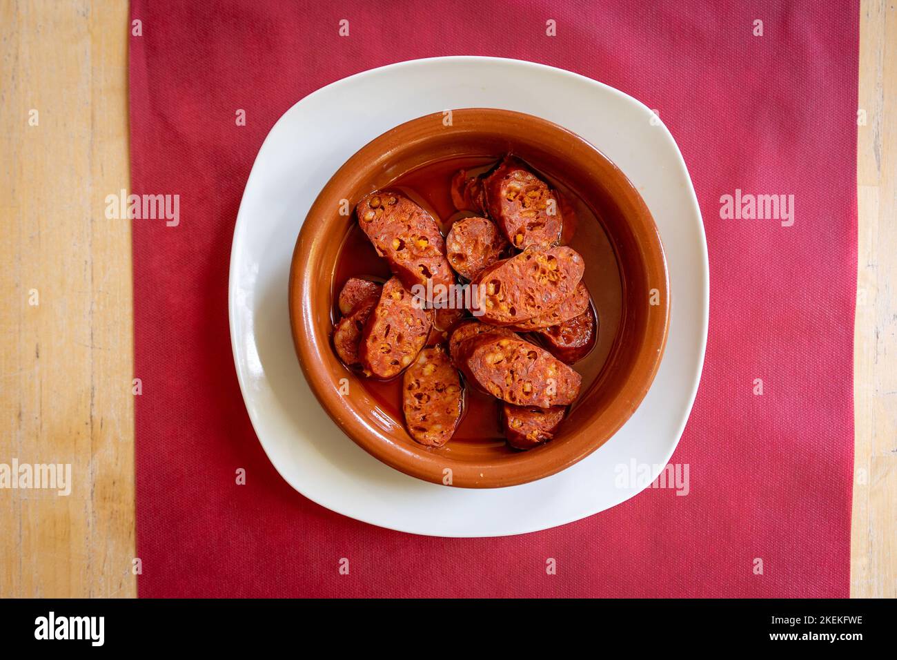 A top-view shot of Chorizo cooked in Cider named as Chorizo a la Sidra ...