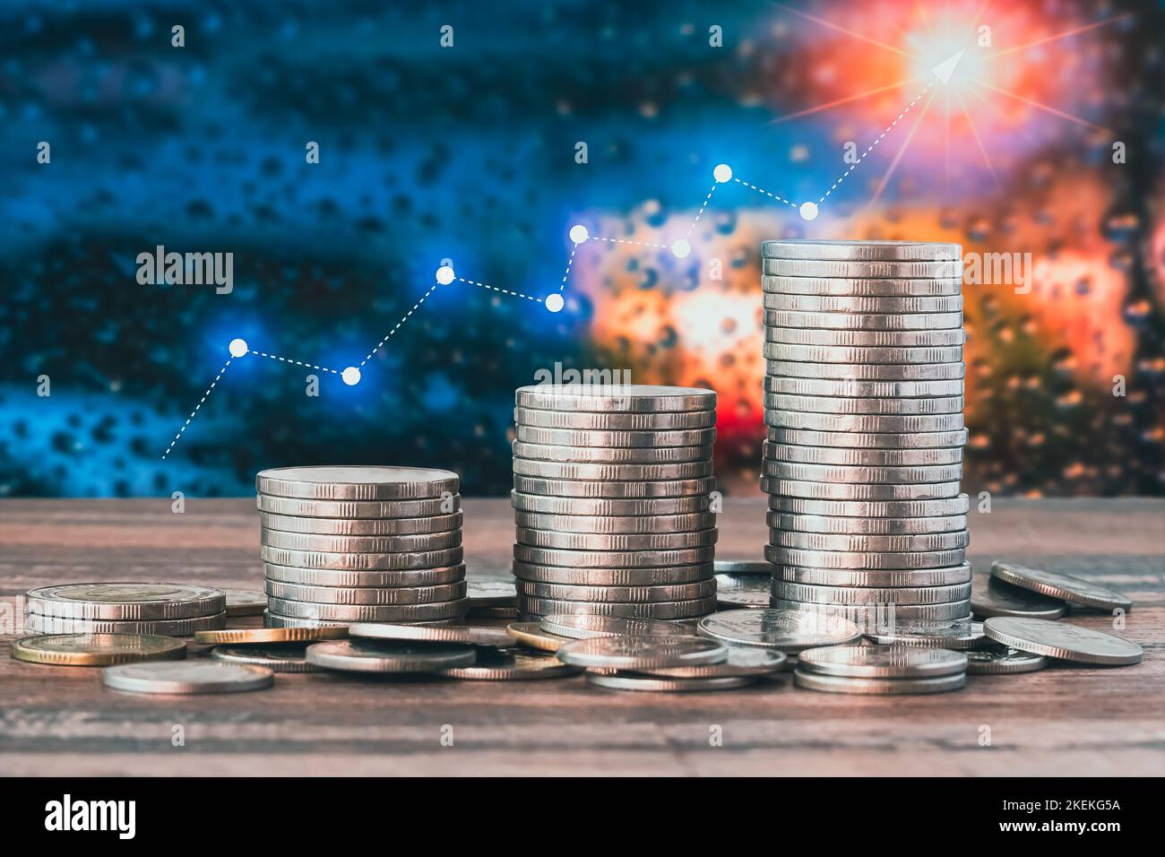 Coins with a moneysaving concept and a profit graph of corporate finance in a piggy bank with