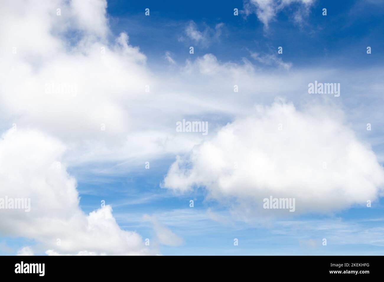 Blue color sky with white fluffy cloud background Stock Photo - Alamy