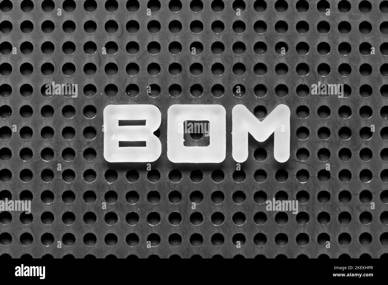 White alphabet letter in word BOM (abbreviation of bill of materials