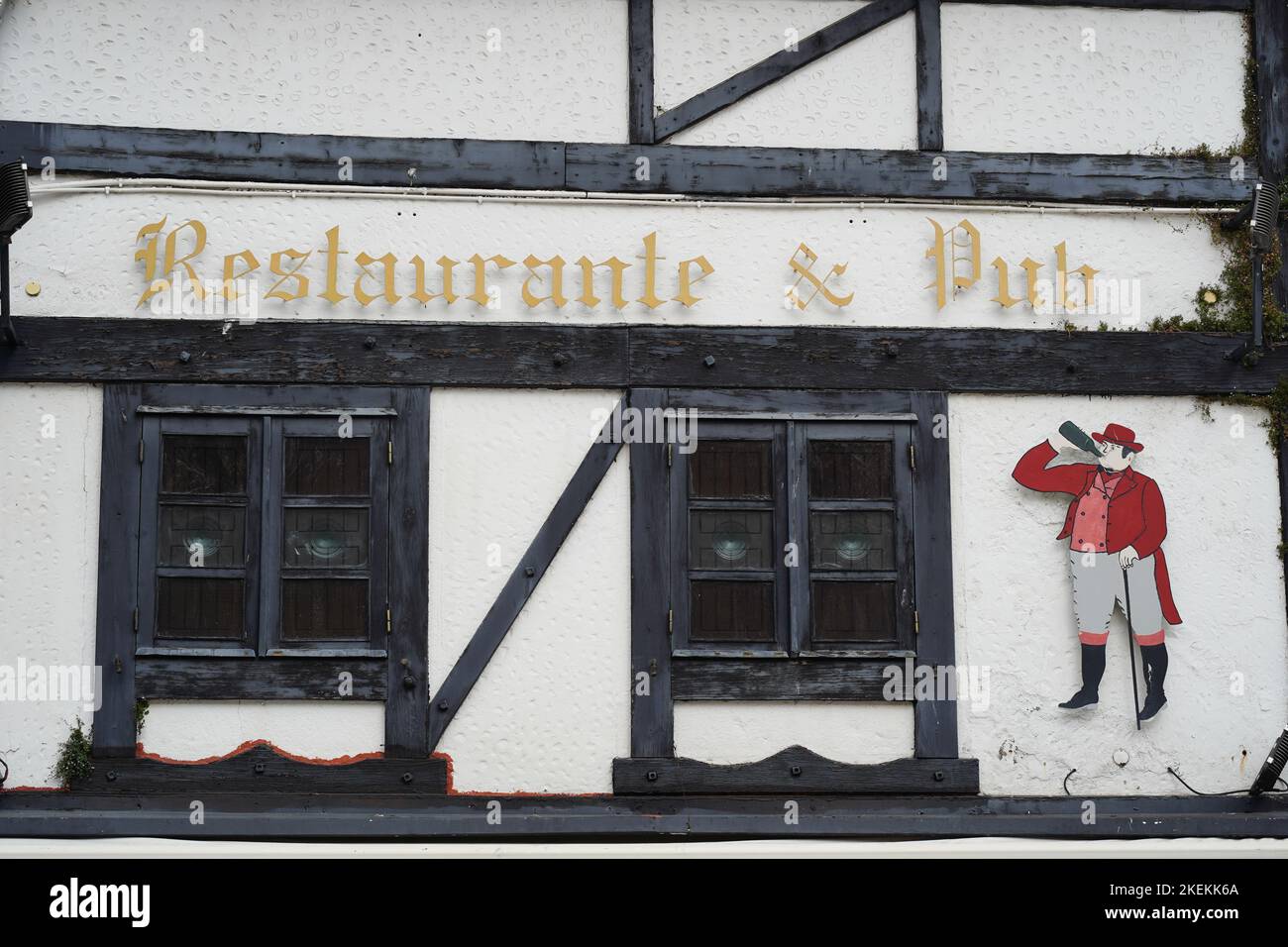 Restaurant and Pub sign with a Tudor style font outside a Tudor style building Stock Photo
