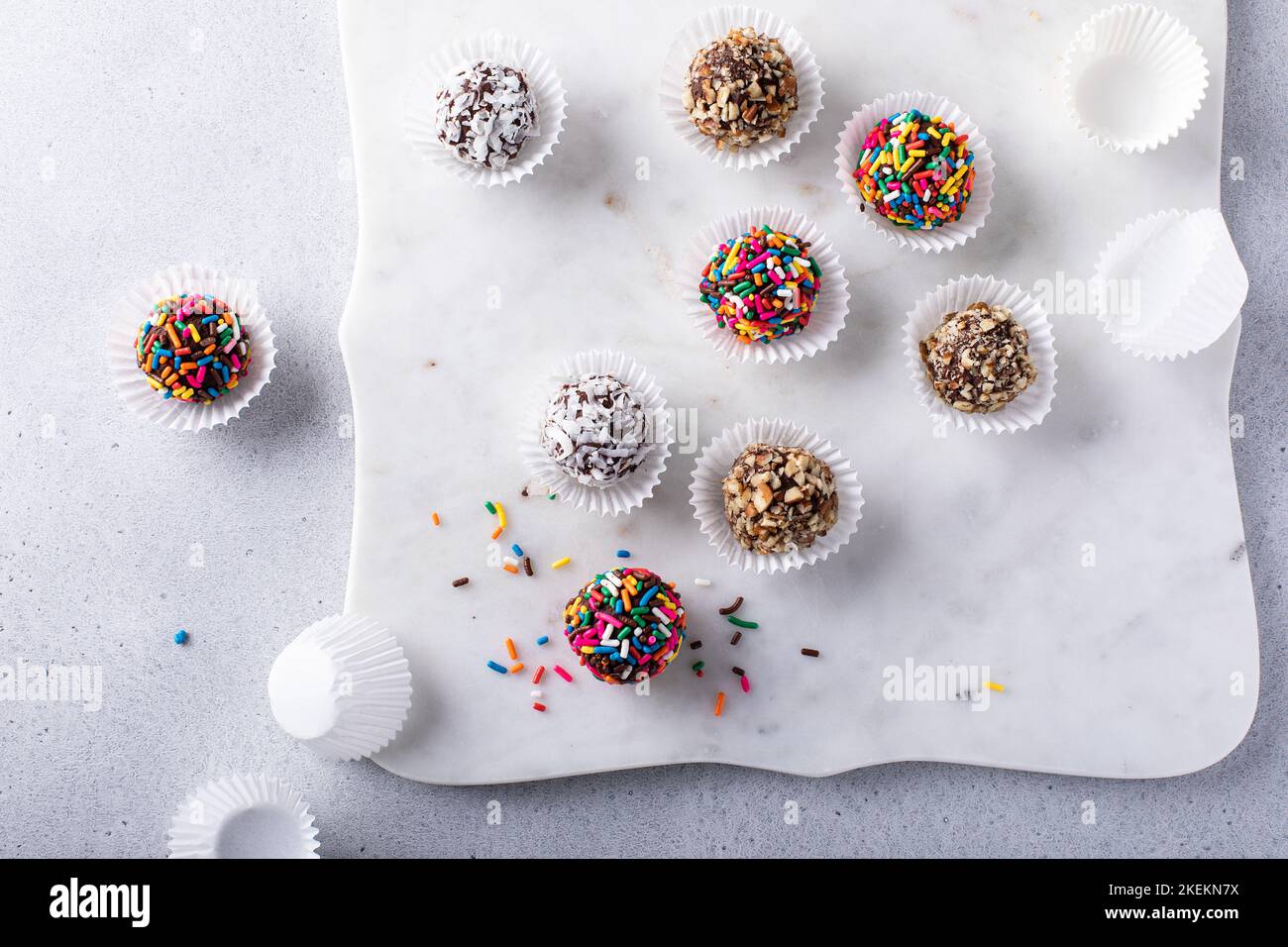 Homemade chocolate truffles covered with sprinkles and nuts Stock Photo