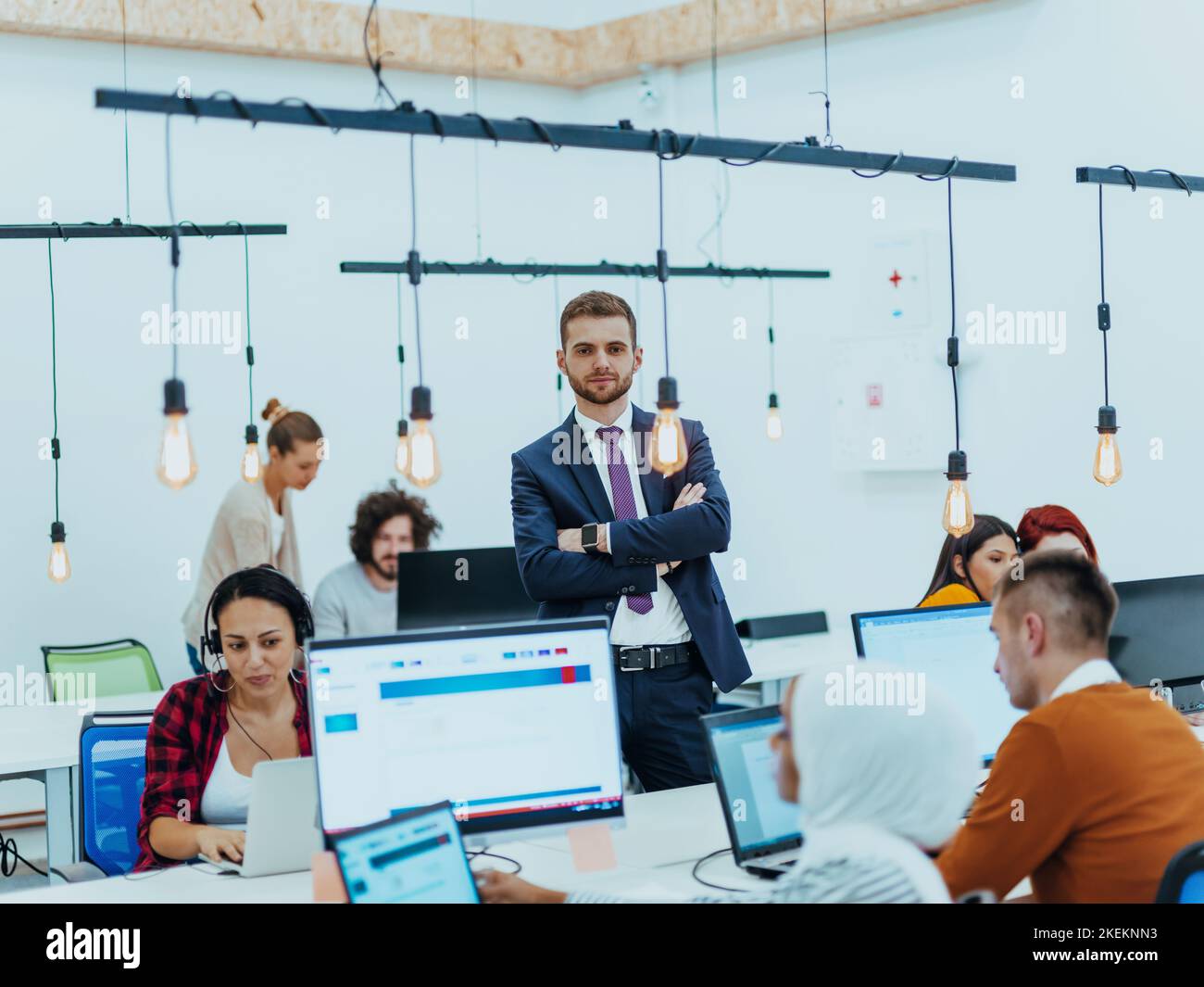 Group of multi-ethnic colleagues working on desktop computers, laptop ...