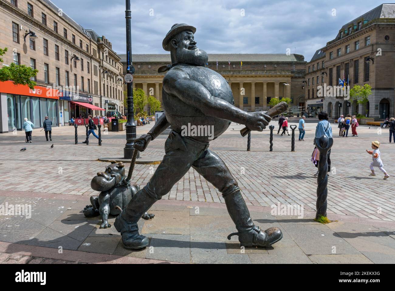 Statue of Desperate Dan and his dog Dawg, characters in the children's comic magazine The Dandy.  High Street, Dundee, Scotland, UK Stock Photo