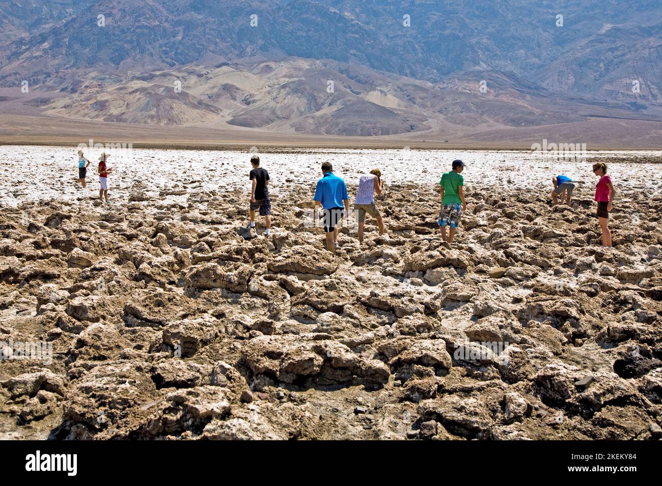 Death Valley, USA - July 19, 2008: people visit  the area of Devils course in the middle of death valley and walk between huge salt plates in Death va Stock Photo