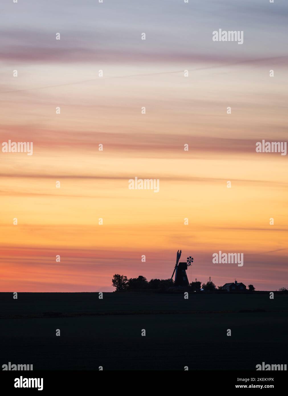 Silhouette of a traditional windmill in the English countryside at sunset. Ripple, Kent Stock Photo