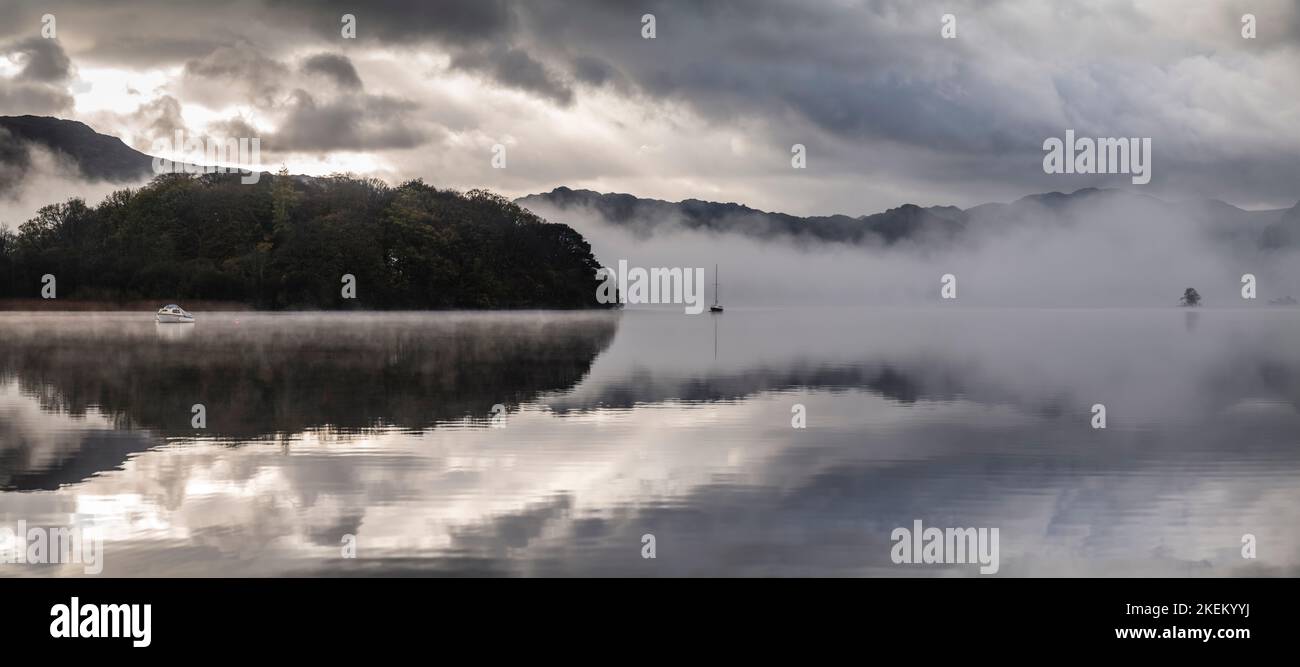 Early morning mist and low cloud hangs over Derwentwater, English Lake District. Stock Photo
