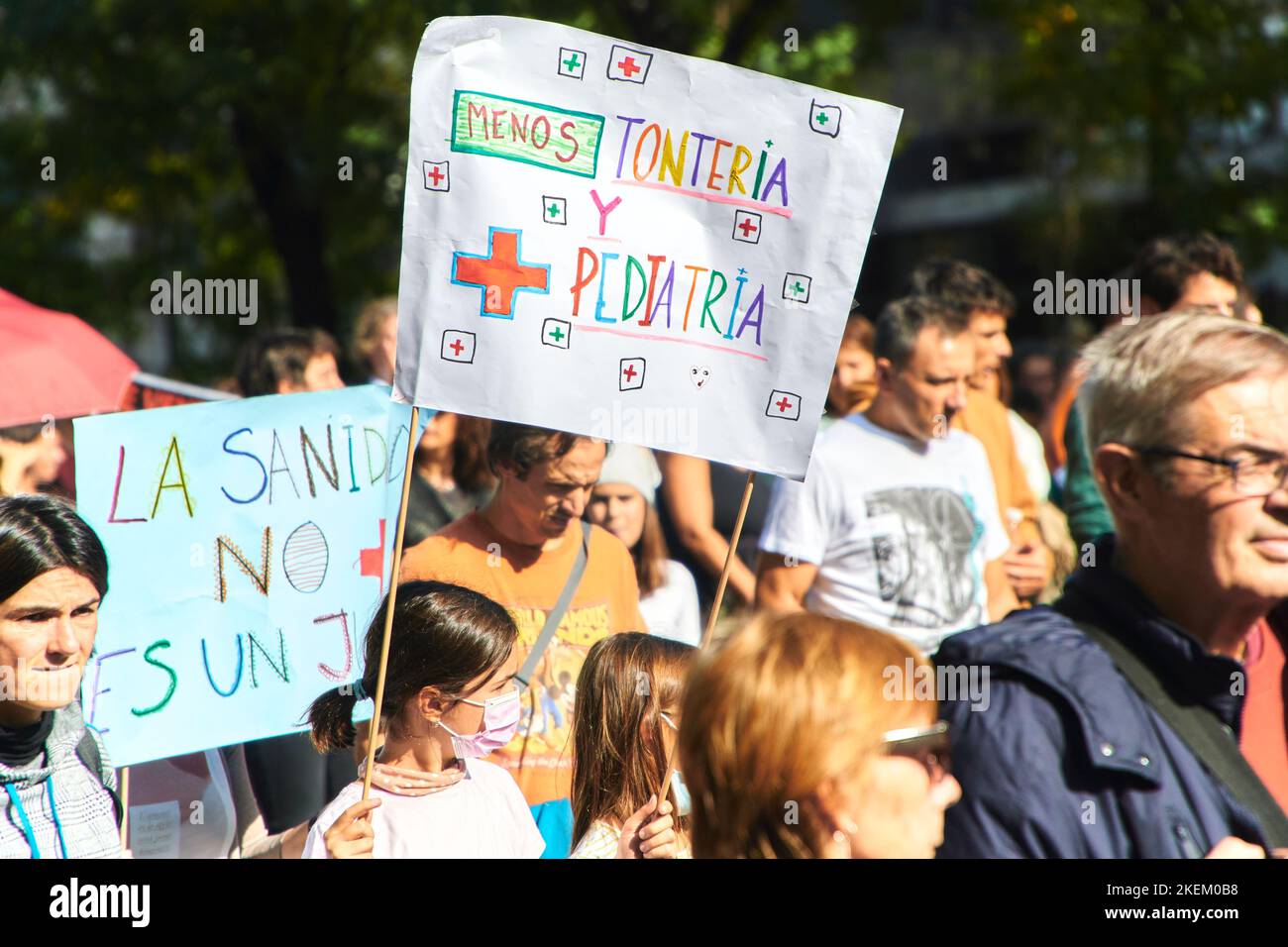 young children protesting in favor of public health on public demonstration with a banner with text 'less nonsense and more pediatrics' on 13th nov 22 Stock Photo