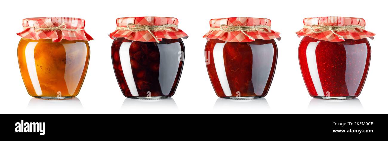 collection of fruit jam in jars covered with paper isolated on white Stock Photo